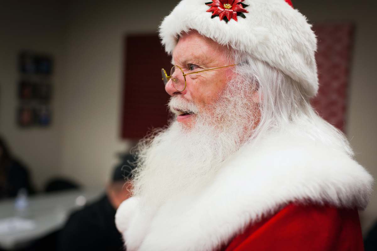 santa claus man in santa hat and eyeglasses current events